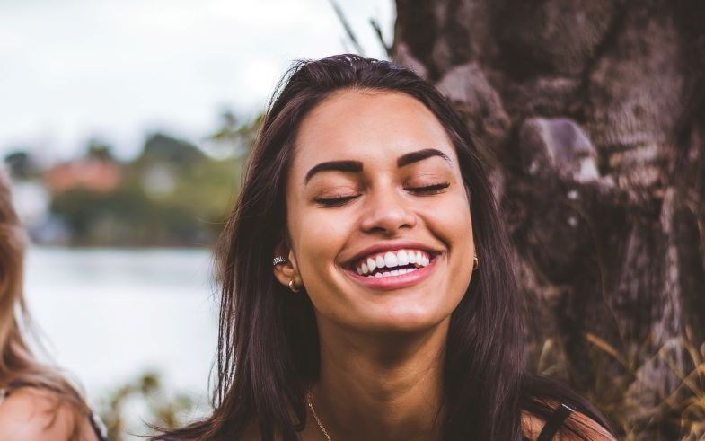 Vaper girl with beautiful white teeth