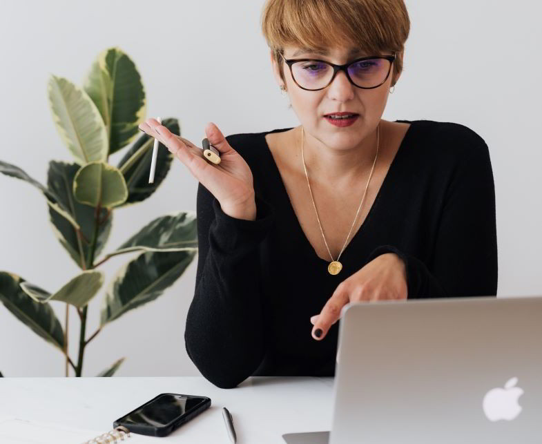 Woman about to smoke in her office