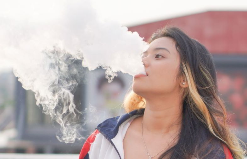 Woman trying a new flavour of vape liquid