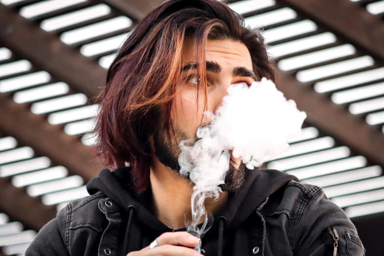 Boy smokes e-cig with homemade liquid