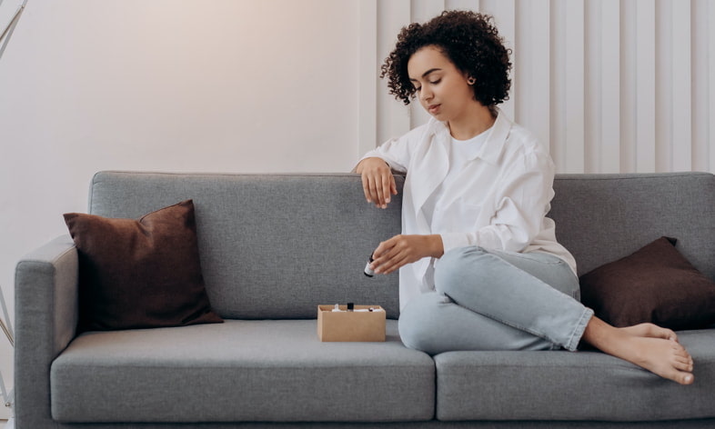 Girl checks her electronic cigarette liquids