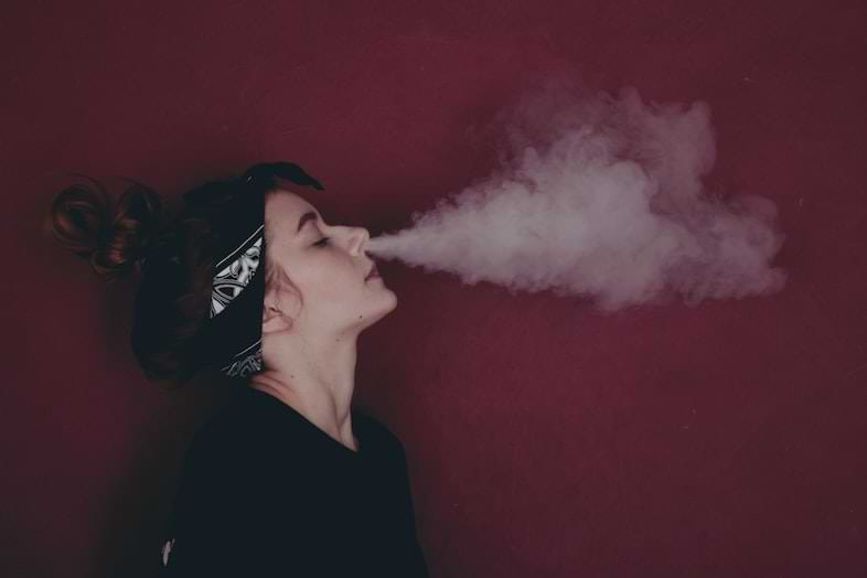 Girl dripping with electronic cigarette