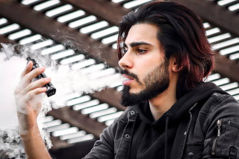 Boy holding ecig while vaping | Terpy